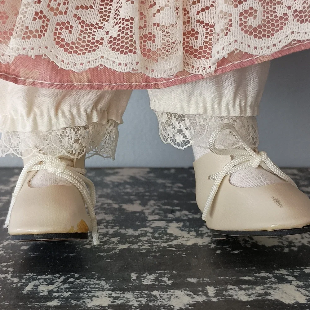 Vintage Porcelain Doll with Pink Dress and Bonnet by Dynasty Dolls
